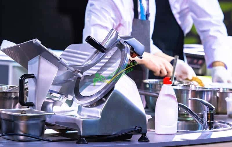 Cleaning A Meat Slicer With Hands