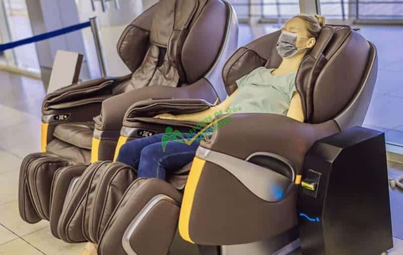 Woman Using A Massage Chair