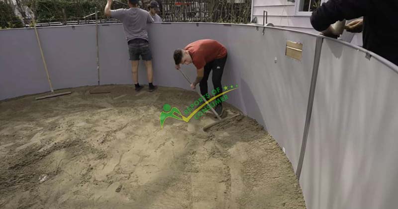 Spreading The Compacted Sand In An Inclined Way Inside The Pool