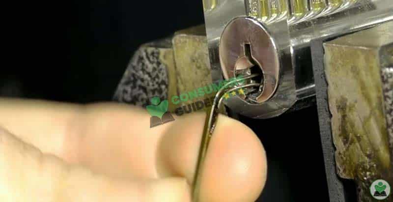 Inserting Bobby Pin Inside Safe Lock To Open It