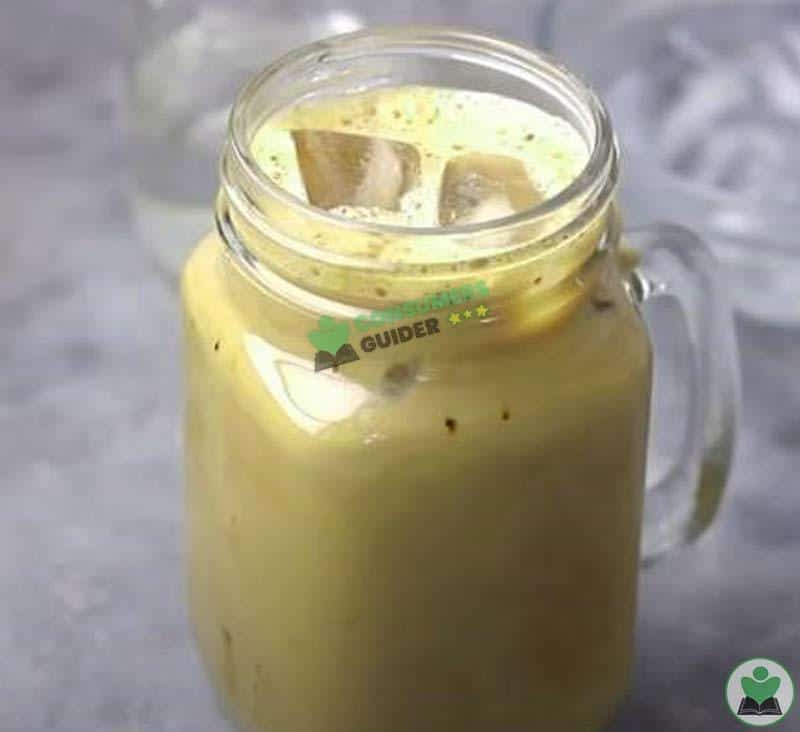 Adding Ice Cubes To The Whole Instant Coffee Mixture To Make Iced Coffee