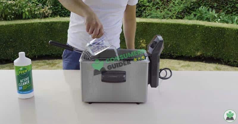 adding the dishwashing liquid in deep fryer for cleaning