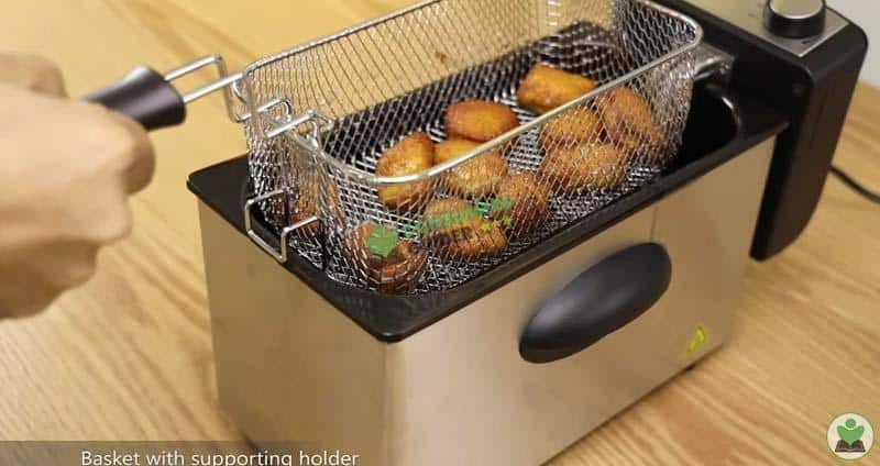 taking out the fried food from the deep fryer